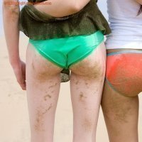 Adolescent girls playing at the beach