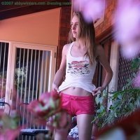 Spy pics of a young slim girl getting dressed