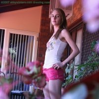 Spy pics of a young slim girl getting dressed