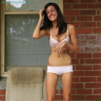 Very skinny girl removing her girly underwear