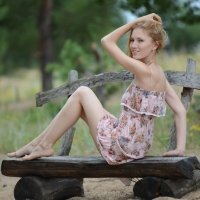 Skinny and pale girl naked outside on a park bench