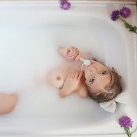 Alisabelle taking a milky bath