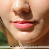 A young nude slim girl outdoors